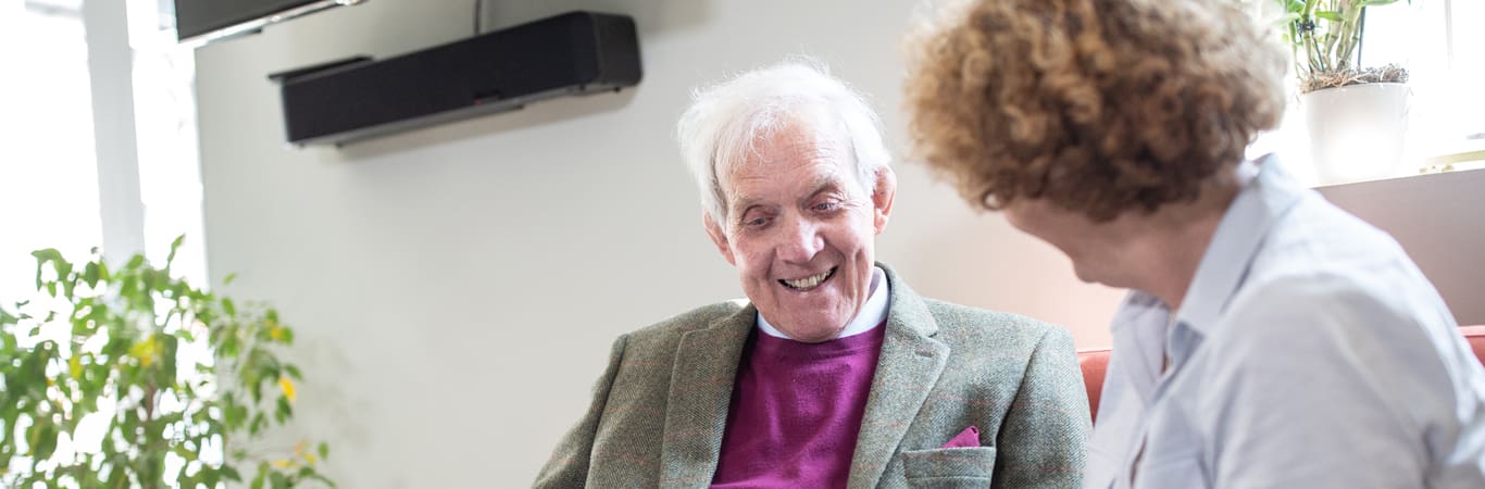 companionship care_carer smiling with a patient_banner