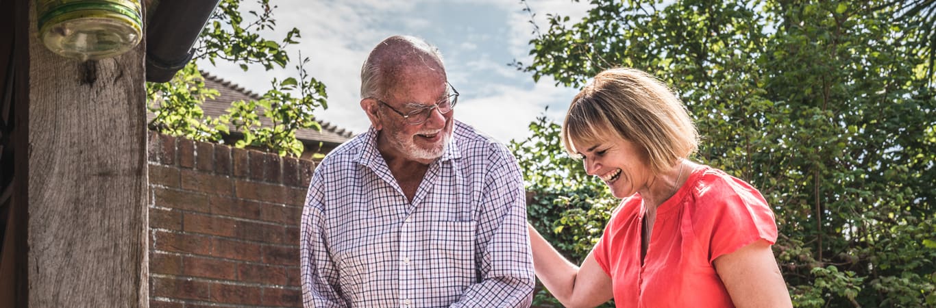 history values_carer laughing with a patient