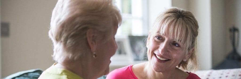 how to become a live-in carer_carer smiling at patient