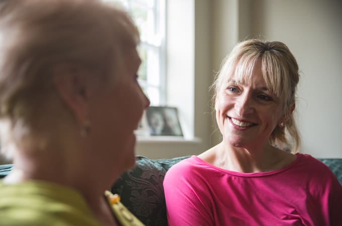 cost of complex care_carer smiling at patient